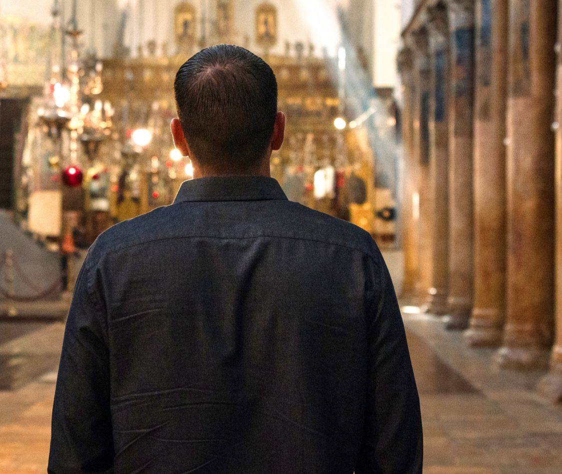 Mark Hartfiel walks down aisle in Church of the Nativity in Bethlehem.